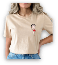 a woman wearing a beige t - shirt with a cartoon girl on it