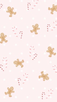 gingerbread and candy canes on a pink background